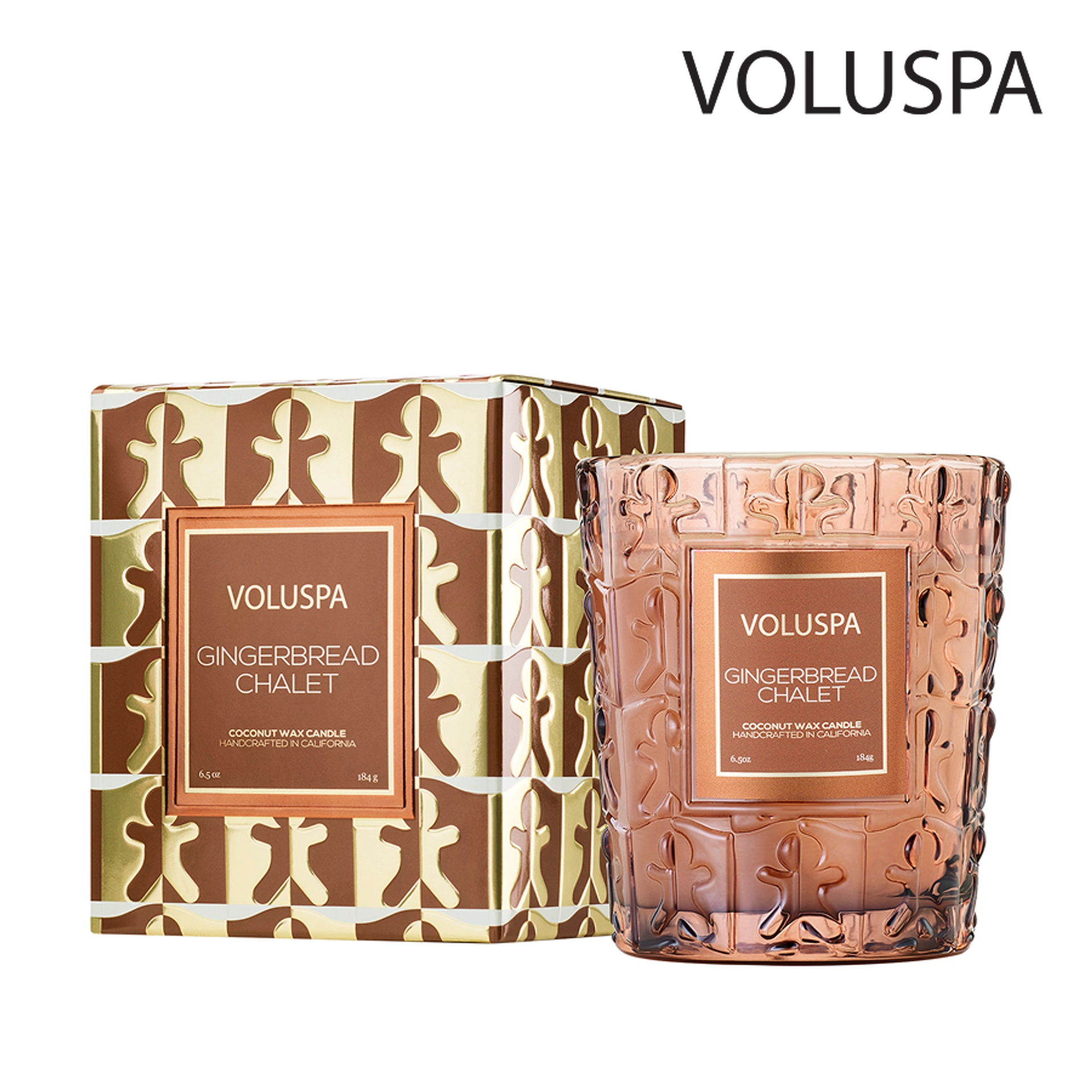 Voluspa Gingerbread Chalet candle in an embossed rose-brown glass jar with a gingerbread man pattern, shown beside its matching brown and metallic gold gift box on a white background.