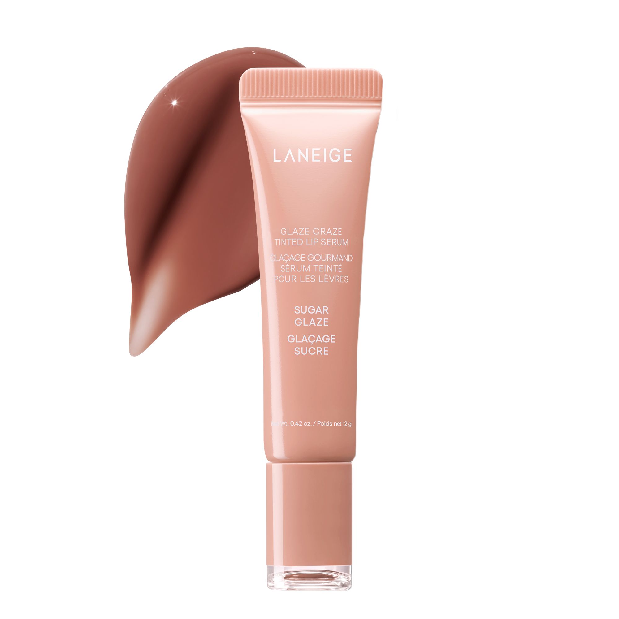 Laneige Glaze Craze Tinted Lip Serum in shade Sugar Glaze, a peachy-nude tube with a matching cap, shown upright beside a glossy warm brown product swatch on a white background.