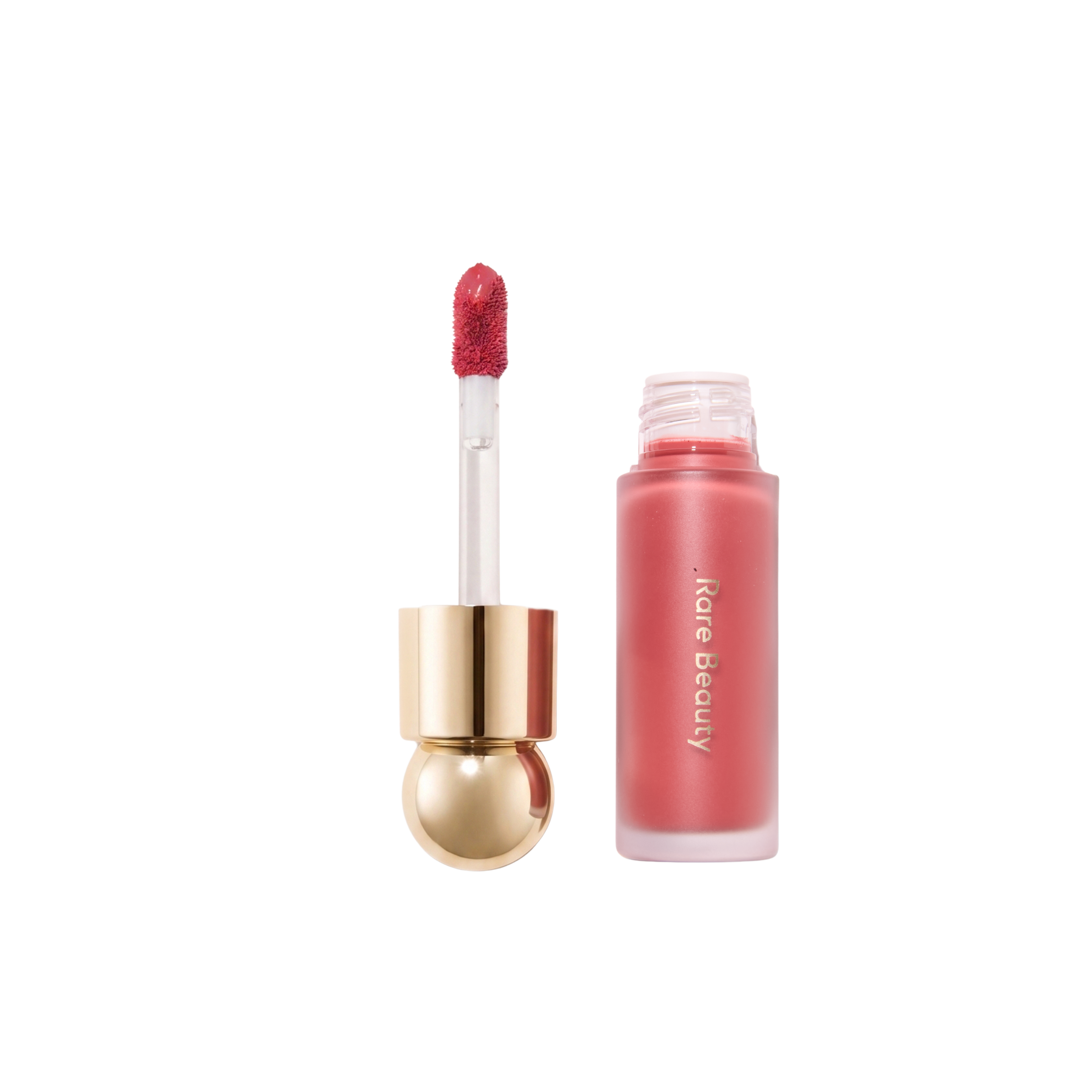 Rare Beauty Soft Pinch Liquid Blush in shade Souvenir, an open frosted bottle of rosy-coral blush beside its gold ball-topped wand with a deep berry-pink applicator tip, on a white background.